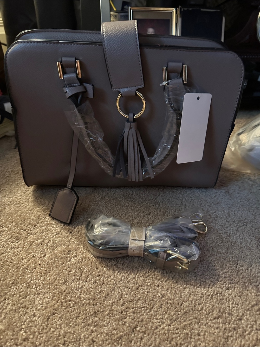 Gray purse with cross body strap